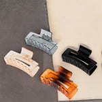 Load image into Gallery viewer, Hair Clutchers for Women – Compact Clips in Black, Amber, and Neutral Tones Set of 4