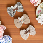 Load image into Gallery viewer, Radhu &amp; Kabby Layered Bow Hair Clips for Girls &amp; Women | Set of 3 Bows in Neutral Shades for Party &amp; Daily Wear
