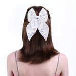 Load image into Gallery viewer, White Satin Hair Bow Clip with Confetti Print Set of 1